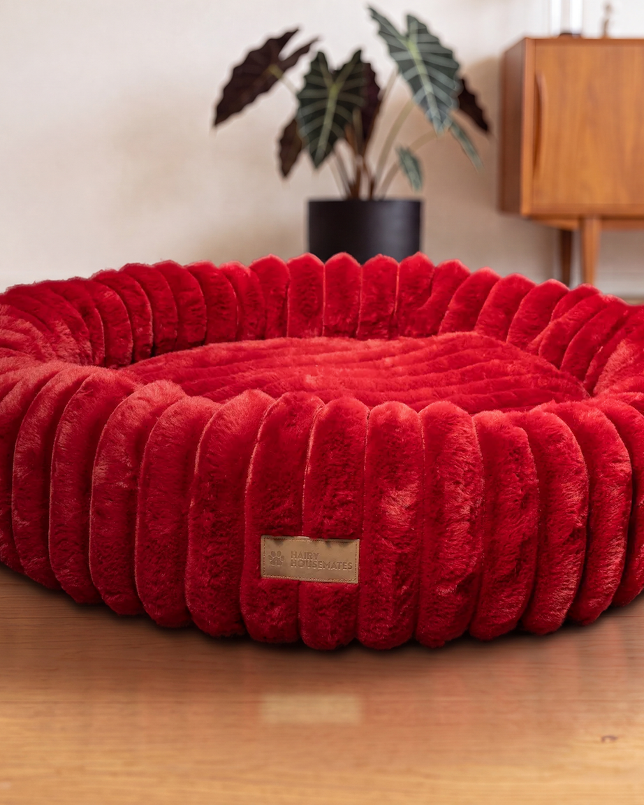 Hairy Housemates Corduroy dog bed in Crimson, on the wooden floor
