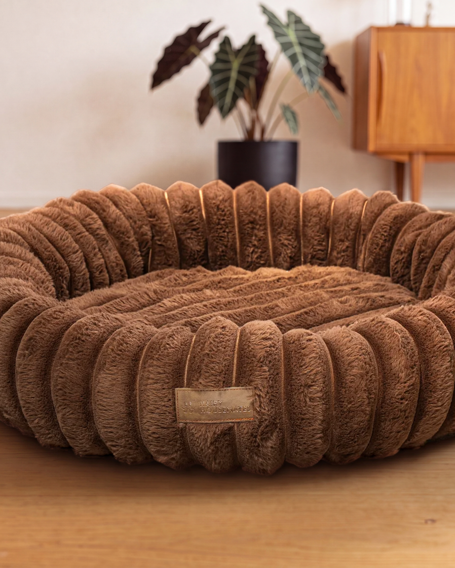 Hairy Housemates Corduroy dog bed in Cocoa, on the wooden floor