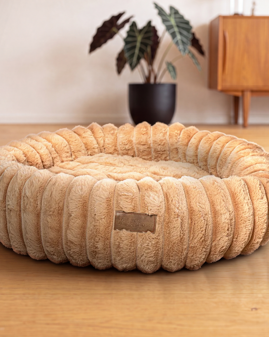 Hairy Housemates Corduroy dog bed in Sand, on the wooden floor